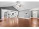 Spacious living room featuring vaulted ceiling, hardwood floors, and access to a modern kitchen at 250 Penn Circle, Galivants Ferry, SC 29544