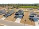 Aerial view of a residential neighborhood showcasing modern two-story homes and manicured lawns at 28 Cape Point Dr., Conway, SC 29527