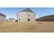 Backyard featuring newly laid grass and a new two story home with lots of room for outdoor living at 28 Cape Point Dr., Conway, SC 29527