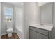 Bathroom features a gray vanity with quartz countertops and tiled shower at 28 Cape Point Dr., Conway, SC 29527