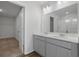 Bathroom with double vanity and open walk-in closet at 28 Cape Point Dr., Conway, SC 29527