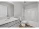 Bathroom with quartz countertop, toilet, and shower/tub combination with a light color scheme at 28 Cape Point Dr., Conway, SC 29527