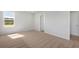 Bedroom with neutral walls and carpet, and windows for natural light at 28 Cape Point Dr., Conway, SC 29527