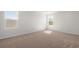 Neutral bedroom with carpet, and sunny windows at 28 Cape Point Dr., Conway, SC 29527