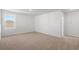 Carpeted bedroom with a single window providing natural light and views of the outdoors at 28 Cape Point Dr., Conway, SC 29527