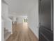 Bright entryway with hardwood floors, staircase, and a view into the open-concept living area at 28 Cape Point Dr., Conway, SC 29527
