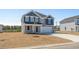 Charming two-story home featuring a gray exterior, two-car garage, and a well-manicured lawn at 28 Cape Point Dr., Conway, SC 29527