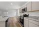 Kitchen features granite counters, stainless appliances, stylish cabinets, and an open layout at 28 Cape Point Dr., Conway, SC 29527