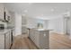 Bright, open kitchen boasts granite countertops, stainless appliances, and modern gray cabinets at 28 Cape Point Dr., Conway, SC 29527