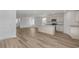 Open-concept kitchen with an island, stainless steel appliances, and hardwood flooring at 28 Cape Point Dr., Conway, SC 29527