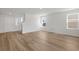 Living room with staircase, modern flooring and walls, and ample sunlight from large window at 28 Cape Point Dr., Conway, SC 29527