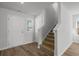 Bright view of a staircase with carpet steps and natural light from a nearby window at 28 Cape Point Dr., Conway, SC 29527