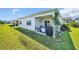 A well-maintained backyard featuring a covered patio with outdoor seating and a grill, perfect for relaxing and entertaining at 2882 Ophelia Way, Myrtle Beach, SC 29577