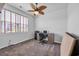 Cozy bedroom features a ceiling fan, neutral carpeting, and natural light from the window at 2882 Ophelia Way, Myrtle Beach, SC 29577