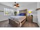 Cozy bedroom featuring a large bed, ceiling fan, natural light, and warm, inviting decor at 2882 Ophelia Way, Myrtle Beach, SC 29577