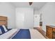 Cozy bedroom features neutral carpeting, a ceiling fan, and a bed with blue accents at 2882 Ophelia Way, Myrtle Beach, SC 29577