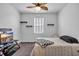 Cozy bedroom featuring a decorative ceiling fan, floating shelves and a comfortable bed with stylish bedding at 2882 Ophelia Way, Myrtle Beach, SC 29577