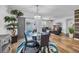 Dining area featuring a glass table set and views of the living room and outdoor space at 2882 Ophelia Way, Myrtle Beach, SC 29577