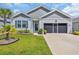 This home features lovely landscaping, a well-manicured lawn and a two-car garage at 2882 Ophelia Way, Myrtle Beach, SC 29577