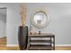 The decorative mirror and accent table add a touch of elegance to the hallway at 2882 Ophelia Way, Myrtle Beach, SC 29577
