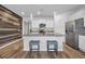 Bright kitchen featuring granite countertops, stainless steel appliances, and a cozy breakfast bar with seating at 2882 Ophelia Way, Myrtle Beach, SC 29577