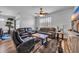 Inviting living room with leather seating, a ceiling fan and a decorative rug over hardwood floors at 2882 Ophelia Way, Myrtle Beach, SC 29577