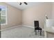 Cozy bedroom featuring neutral carpet, a well-lit window, and comfortable chair at 308 Firenze Loop, Myrtle Beach, SC 29579