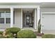 Charming front porch with cozy seating, providing a warm welcome to the home at 308 Firenze Loop, Myrtle Beach, SC 29579