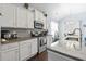 Well-equipped kitchen with stainless appliances, granite countertops, and ample storage space at 308 Firenze Loop, Myrtle Beach, SC 29579
