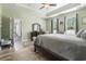 Spacious main bedroom featuring wood floors, neutral paint, and walk-in closet at 308 Firenze Loop, Myrtle Beach, SC 29579
