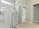 Walk-in shower stall with glass door, tile surround, and built-in shelves at 308 Firenze Loop, Myrtle Beach, SC 29579