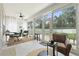 Bright sunroom featuring many windows and backyard access at 308 Firenze Loop, Myrtle Beach, SC 29579