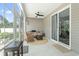 Bright sunroom featuring tile floor, comfortable seating and sliding glass doors to the home's exterior at 308 Firenze Loop, Myrtle Beach, SC 29579
