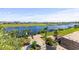 Scenic backyard view with lush greenery, a dock, and a tranquil lake, perfect for outdoor enjoyment at 337 St. Julian Ln., Myrtle Beach, SC 29579