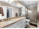 Elegant bathroom featuring double sinks, granite countertops, and a glass-enclosed shower at 337 St. Julian Ln., Myrtle Beach, SC 29579