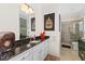 Cozy bathroom with marble countertops, white cabinets, and a framed mirror at 337 St. Julian Ln., Myrtle Beach, SC 29579