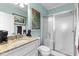 Clean bathroom with granite countertop vanity, walk-in shower, and light blue walls at 337 St. Julian Ln., Myrtle Beach, SC 29579