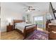 Bedroom with hardwood floors, a ceiling fan, access to a balcony, and natural light at 337 St. Julian Ln., Myrtle Beach, SC 29579