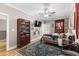 Bedroom featuring hardwood floors, a ceiling fan, a glass door to a balcony, and decor at 337 St. Julian Ln., Myrtle Beach, SC 29579