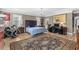 Spacious primary bedroom with hardwood floors, exercise equipment, and a separate desk area at 337 St. Julian Ln., Myrtle Beach, SC 29579