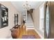 Inviting foyer featuring hardwood floors, an elegant chandelier, and a staircase leading to the upper level at 337 St. Julian Ln., Myrtle Beach, SC 29579