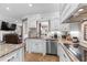 The kitchen has white cabinets, stainless steel appliances and granite countertops at 337 St. Julian Ln., Myrtle Beach, SC 29579