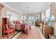 Spacious bedroom with a decorative bed, chandelier, and access to an outdoor patio at 337 St. Julian Ln., Myrtle Beach, SC 29579
