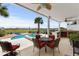 A charming outdoor patio with dining and cooking areas, perfect for relaxing and enjoying the lake views at 337 St. Julian Ln., Myrtle Beach, SC 29579