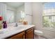 Bathroom features a white sink, wooden vanity, and a clean, well-lit space, blending functionality and style at 364 Vesta Dr., Myrtle Beach, SC 29579