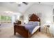 Cozy bedroom with a wooden bed frame, vaulted ceiling, a reading desk and plenty of natural light at 364 Vesta Dr., Myrtle Beach, SC 29579