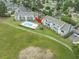 Aerial view showcasing community pool, landscaping, and nearby building at 3700 Golf Colony Lane # 26A, Little River, SC 29566