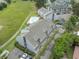 Aerial view showcasing community parking, landscaping, and swimming pool at 3700 Golf Colony Lane # 26A, Little River, SC 29566