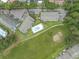 Aerial view highlighting community pool, landscaping, and parking at 3700 Golf Colony Lane # 26A, Little River, SC 29566
