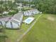 Aerial view featuring landscaping, community pool, and nearby building at 3700 Golf Colony Lane # 26A, Little River, SC 29566